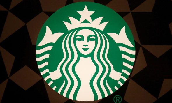 A Starbucks logo is pictured on the door of the Green Apron Delivery Service at the Empire State Building in New York