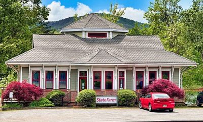 A State Farm Insurance office occupies a classic railroad depot