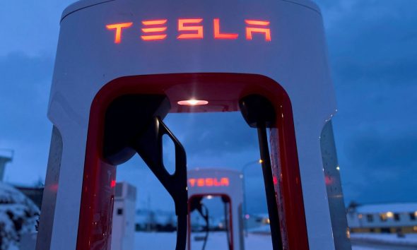 Tesla electric vehicle chargers are seen during the winter in Hofn
