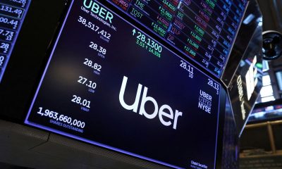 The Uber logo is seen on the trading floor at the New York Stock Exchange (NYSE) in Manhattan, New York City