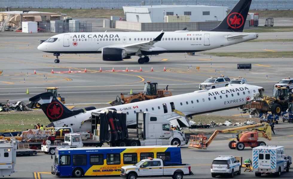 Mangled plane involved in LaGuardia crash is towed from runway