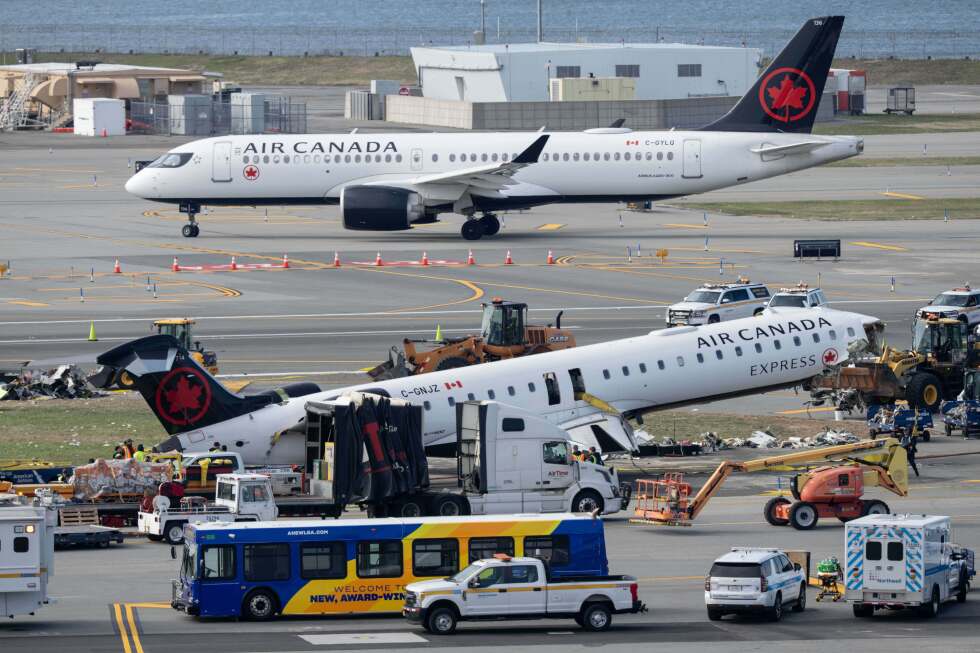 Mangled plane involved in LaGuardia crash is towed from runway