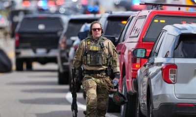 Armed man rammed vehicle into Michigan synagogue and was fatally shot by security, AP source says