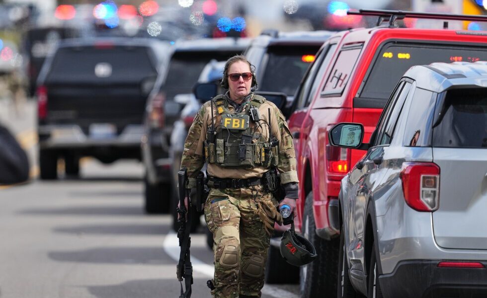 Armed man rammed vehicle into Michigan synagogue and was fatally shot by security, AP source says