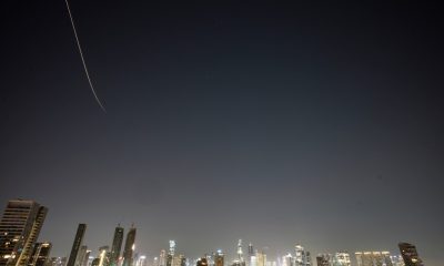 Iran targets Israel and Gulf Arab states even as Trump says US is in talks to end the war