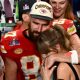 US singer-songwriter Taylor Swift and Kansas City Chiefs' tight end Travis Kelce embrace after the Super Bowl on Sunday