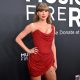 US singer-songwriter Taylor Swift rocked the red at the Grammys, and raised eyebrows with her thigh chain
