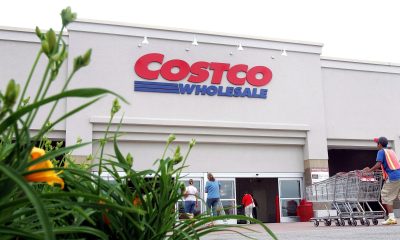 A worker pushes carts outside a Costco Wholesale store on May 31, 2006, in Mount Prospect, Illinois.
