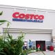 A worker pushes carts outside a Costco Wholesale store on May 31, 2006, in Mount Prospect, Illinois.