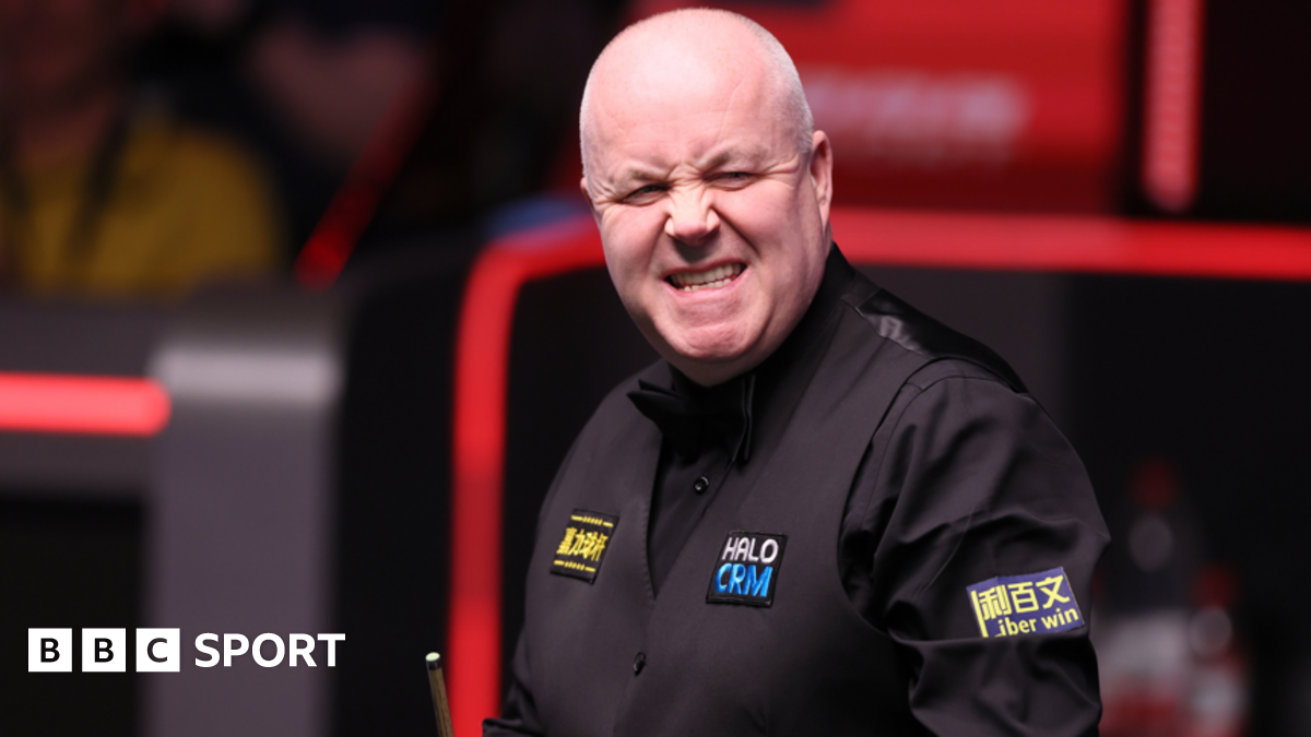 John Higgins grimaces