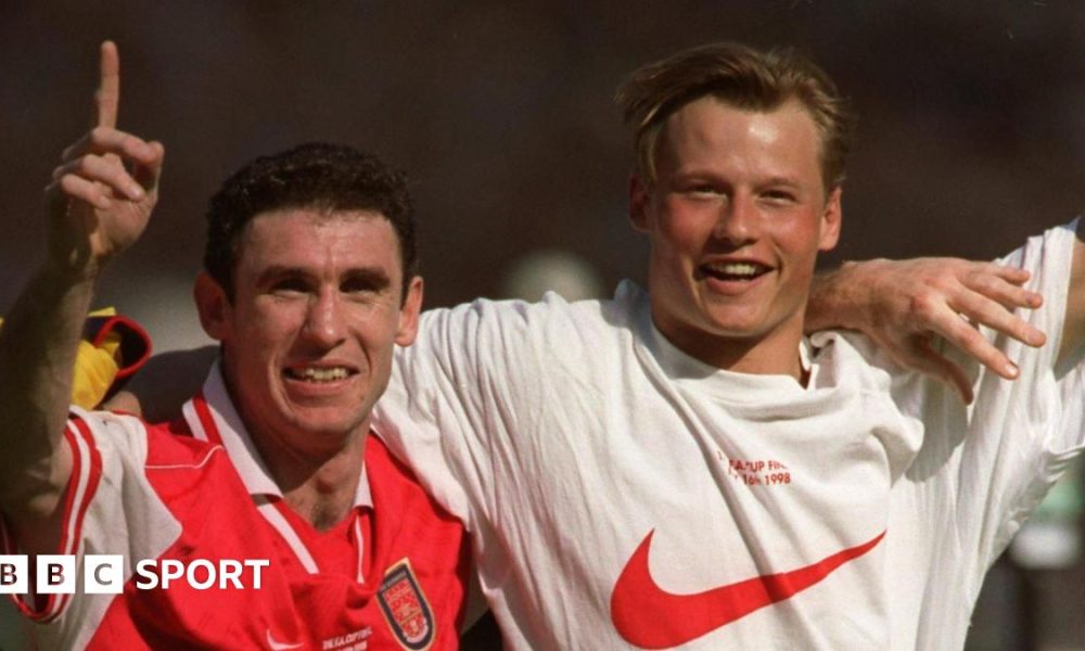 Martin Keown (left) and Alex Manninger celebrate together at Wembley after Arsenal's FA Cup final win over Newcastle in 1998