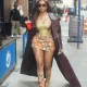 1 Yung Miami In Brown Dolce Gabbana Floral Mini Skirt And Matching Boots With Gold Corset Top In New York