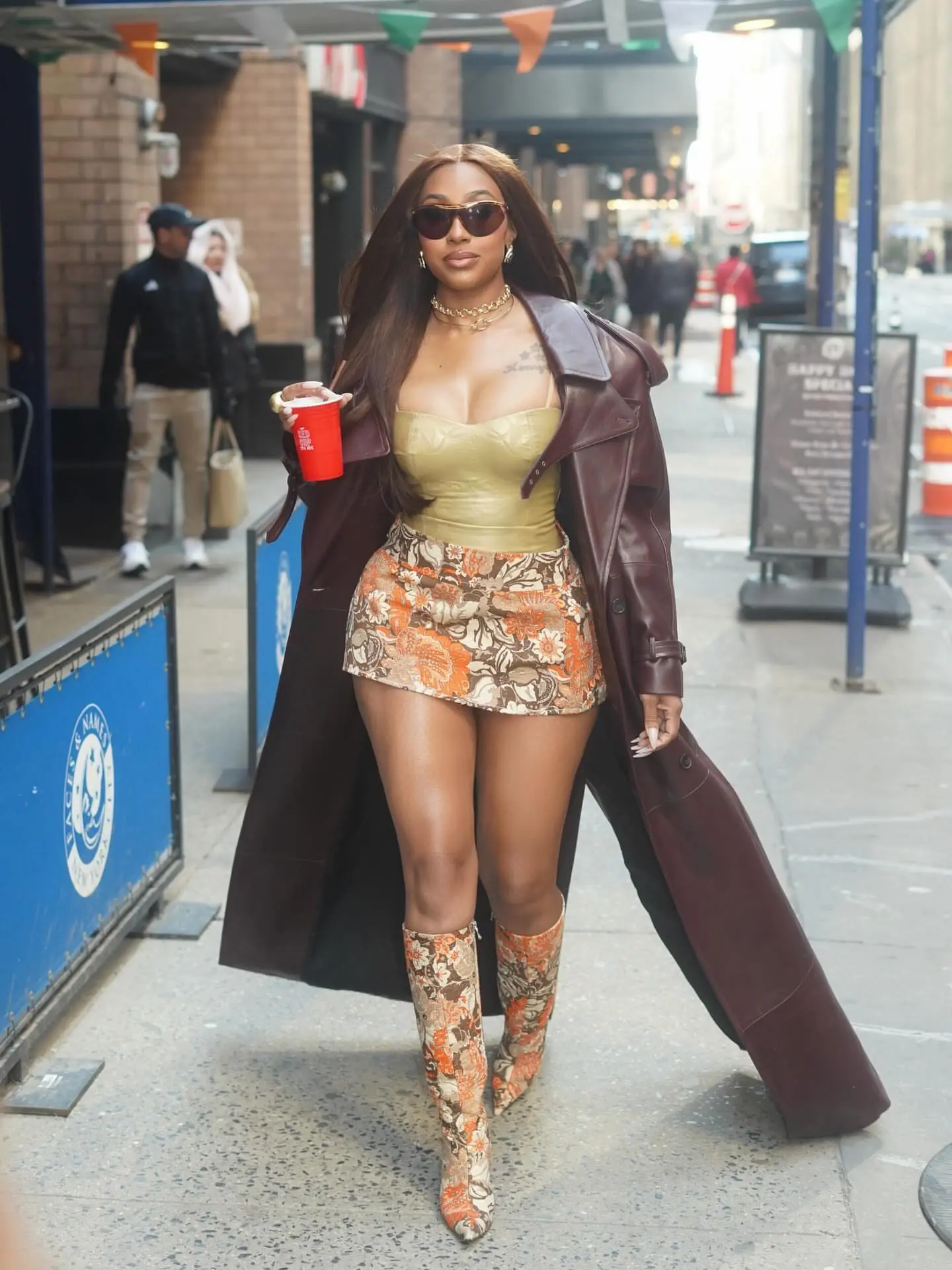 1 Yung Miami In Brown Dolce Gabbana Floral Mini Skirt And Matching Boots With Gold Corset Top In New York