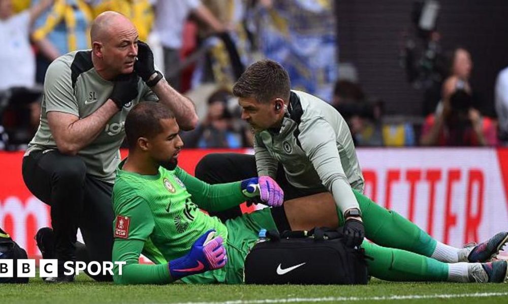 Robert Sanchez receives treatment for an apparent injury during the FA Cup semi-final between Chelsea and Leeds United at Wembley Stadium
