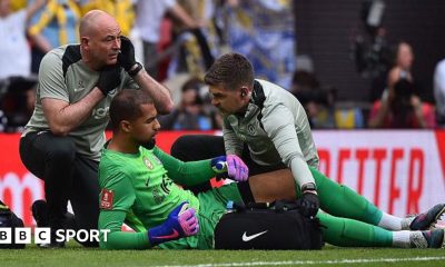 Robert Sanchez receives treatment for an apparent injury during the FA Cup semi-final between Chelsea and Leeds United at Wembley Stadium