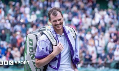 Jamie and Andy Murray touch hands