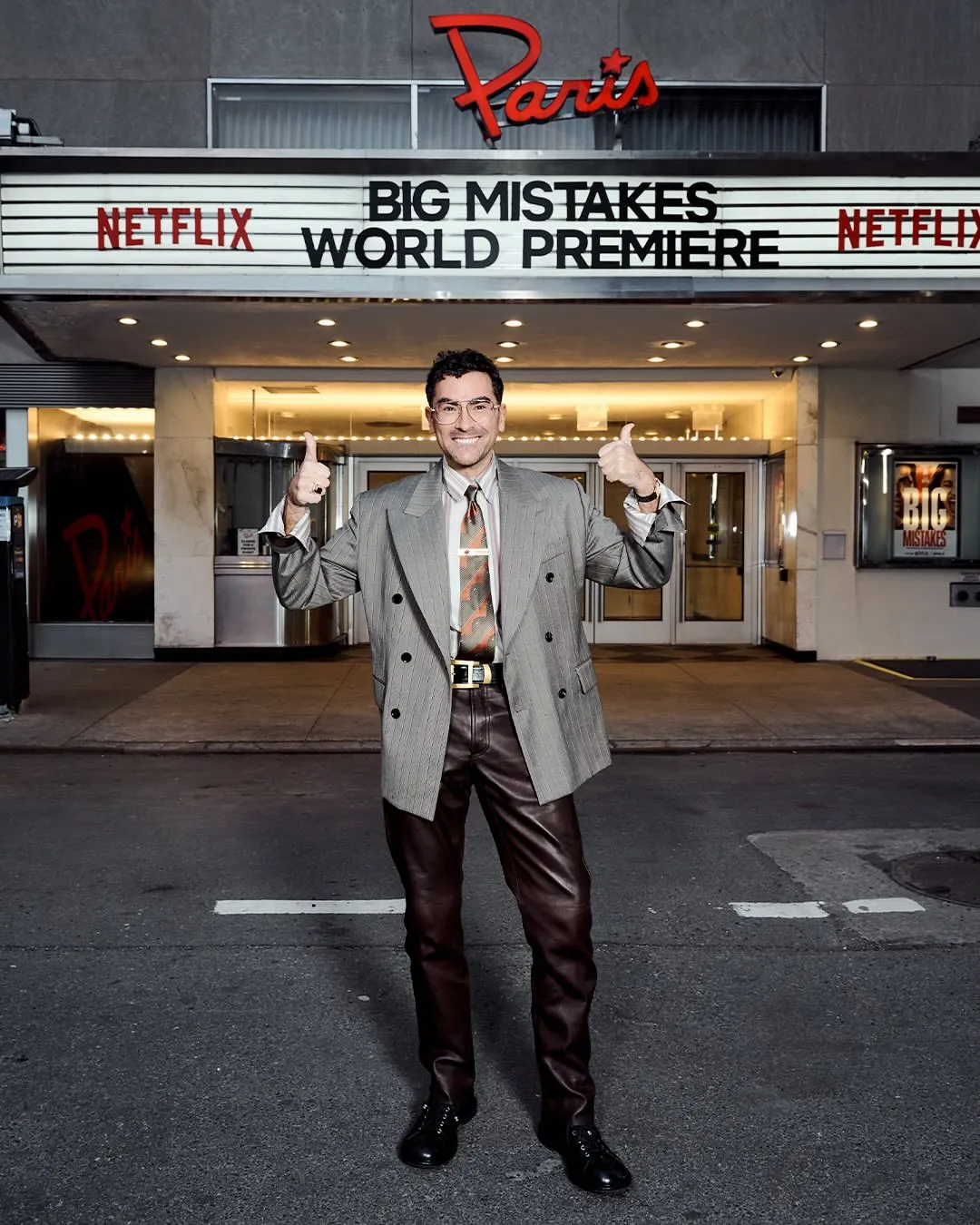 2 Dan Levy In Grey Pinstripe Versace Spring 2026 Blazer Brown Leather Pants And Silk Shirt At Big Mistakes Premiere