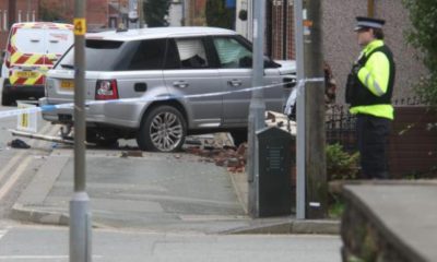 Man charged after car crashes into house in Bolton