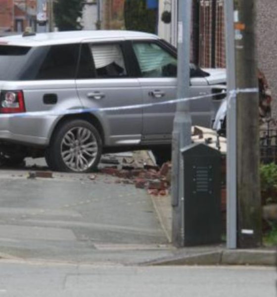 Man charged after car crashes into house in Bolton