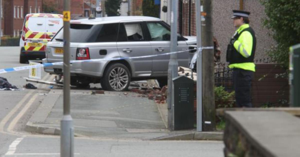 Man charged after car crashes into house in Bolton