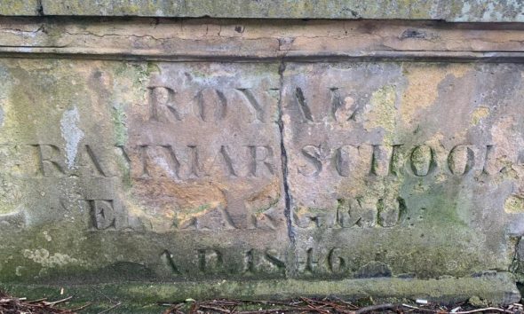 The churchyard stone that marks Darlington’s grammar school history
