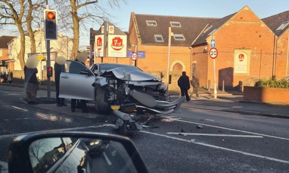 Wigan Road crash brings down traffic lights on island