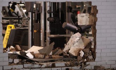 Car recovered after crashing through gym wall leaves large hole