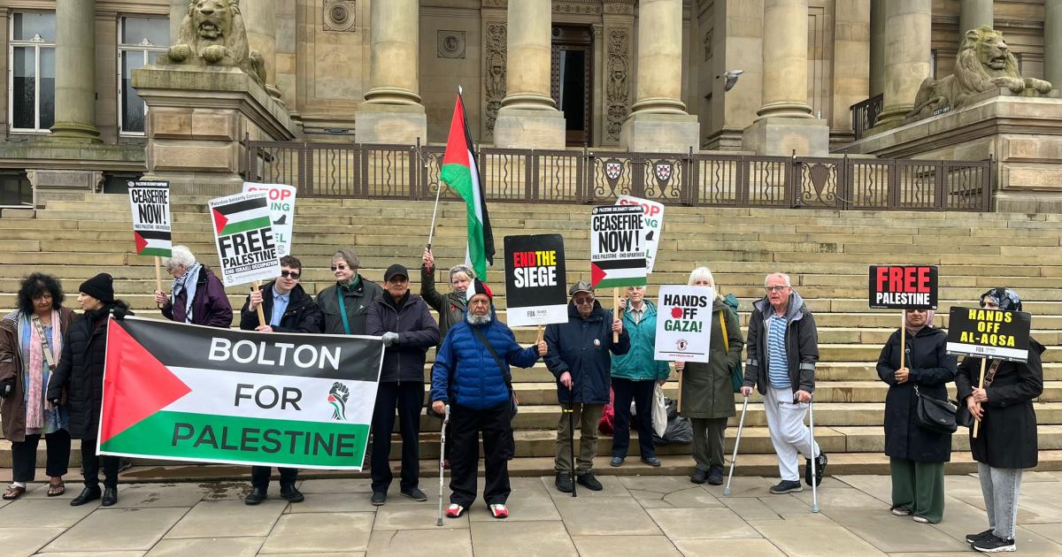 Pro-Palestine protesters gather outside Bolton Town Hall