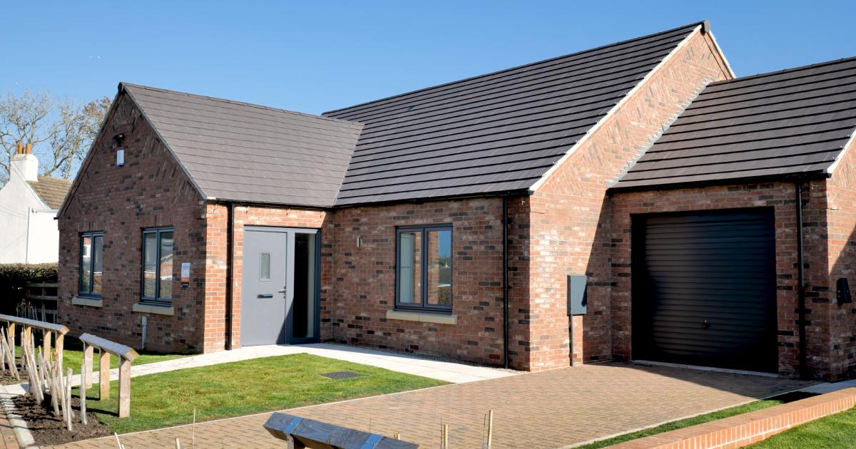 Low-carbon bungalows completed in village