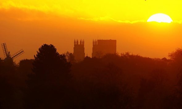York Minster and Holgate Windmill pictured at sunrise