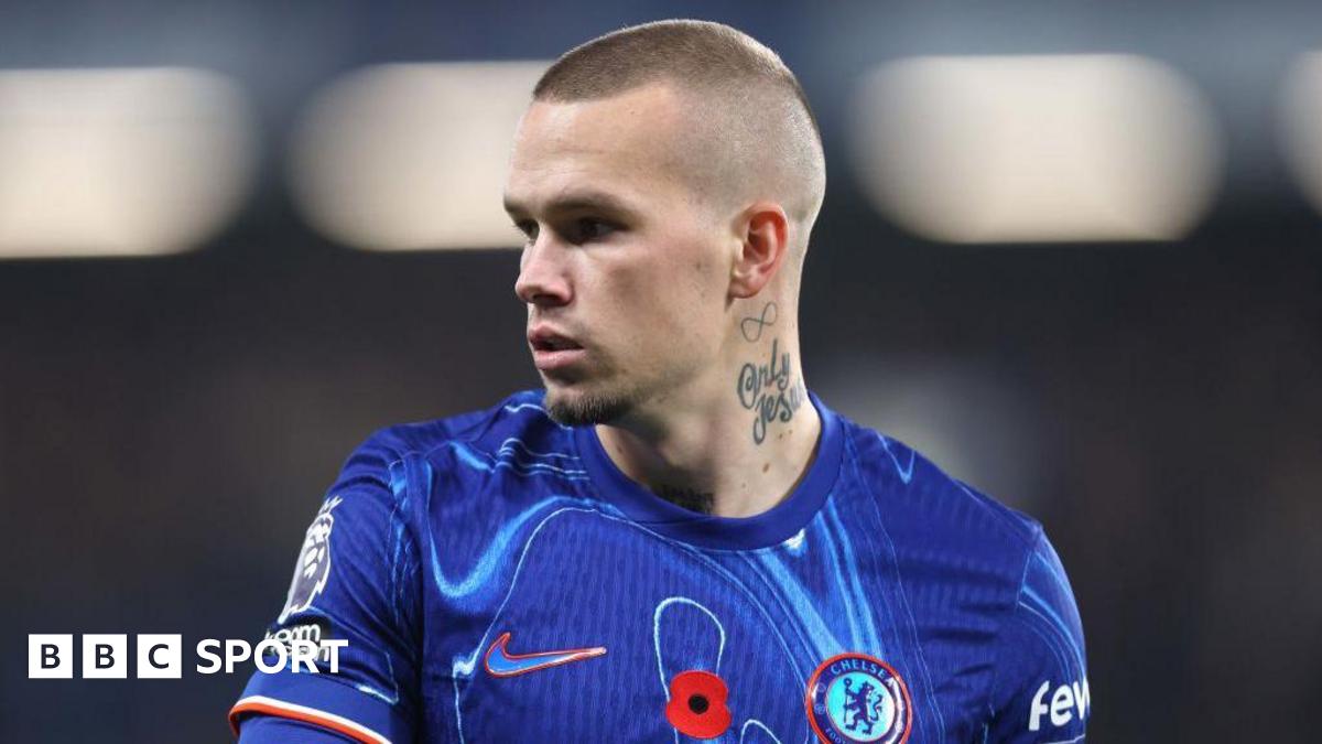 Mykhailo Mudryk looking to his right while playing in a Chelsea kit