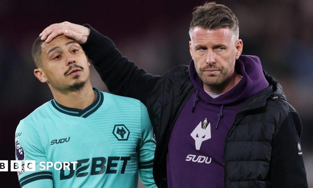 Rob Edwards with his hand on Andre's head