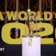 The World Cup on display on a white stand prior to the draw in December in Washington with Fifa World Cup 2026 in big gold letters in the background.