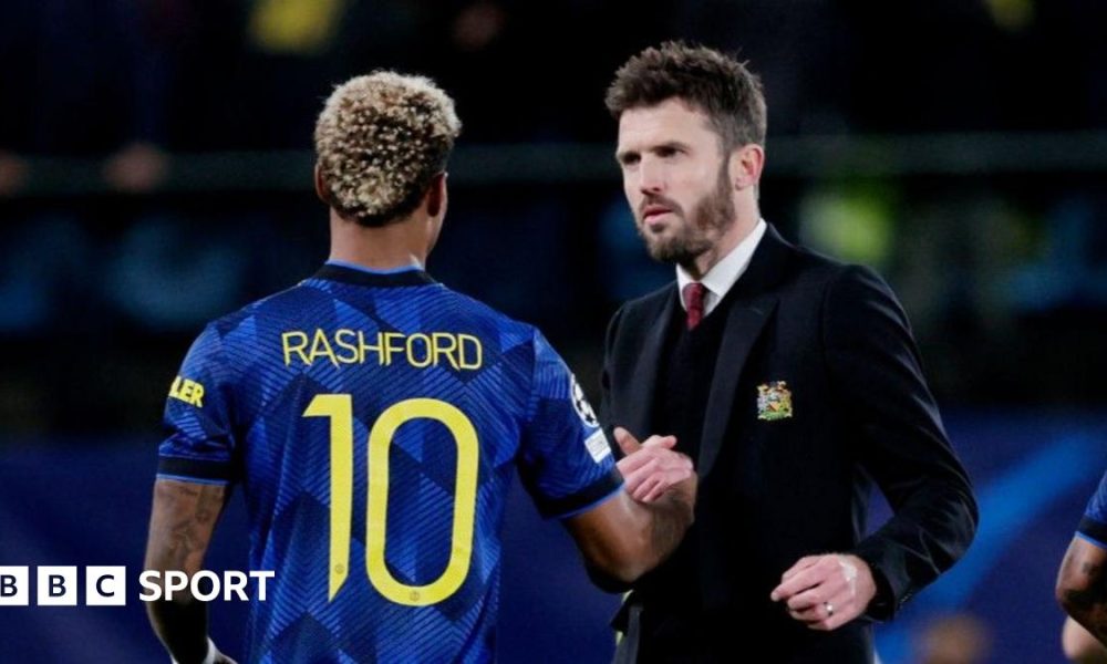 Michael Carrick greets Marcus Rashford