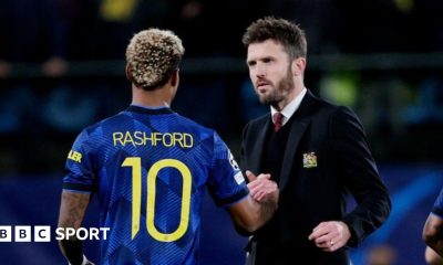 Michael Carrick greets Marcus Rashford