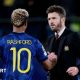 Michael Carrick greets Marcus Rashford