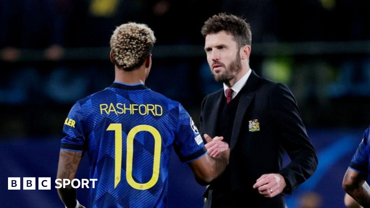 Michael Carrick greets Marcus Rashford