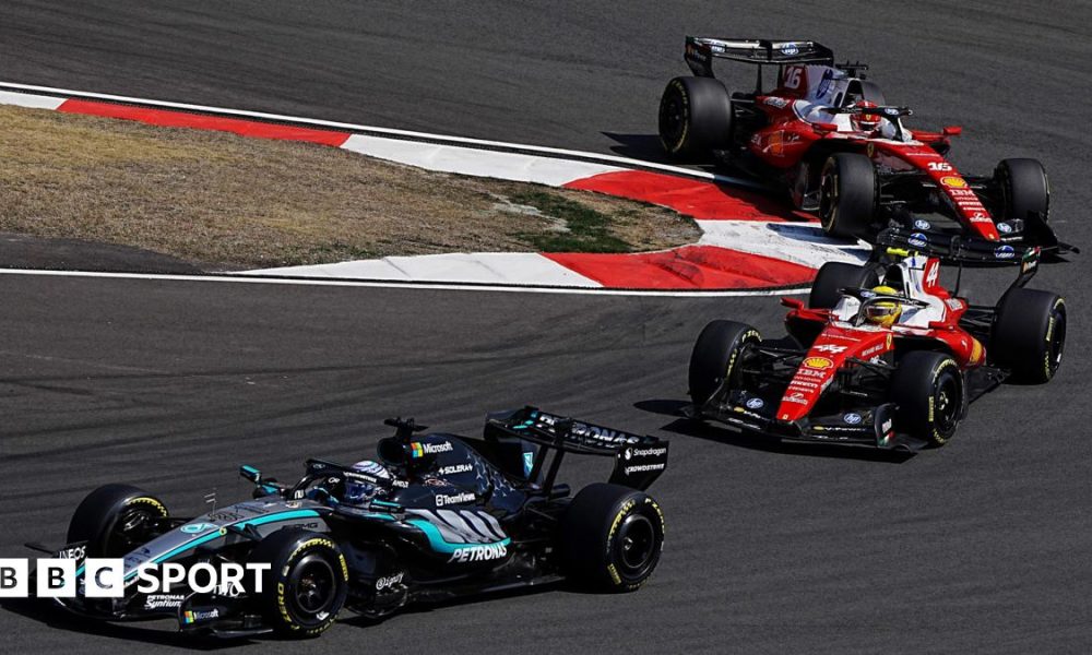 Mercedes' George Russell comes out of a hairpin ahead of Ferrari's Lewis Hamilton with Charles Leclerc immediately behind during the Chinese Grand Prix sprint race