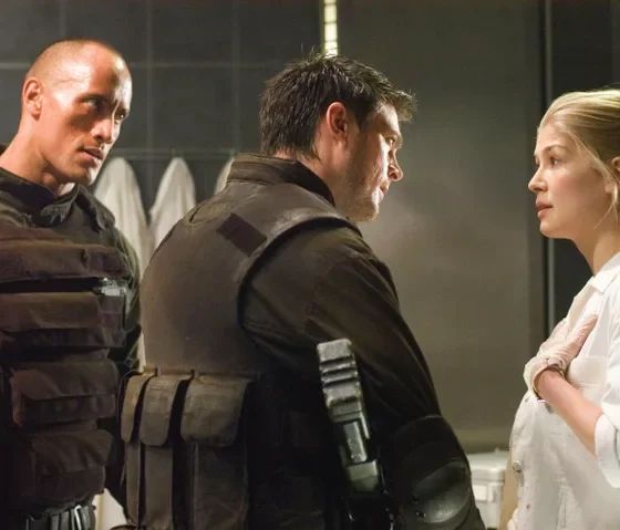 Dwayne "The Rock" Johnson and Rosamund Pike shared the screen in the 2005 movie adaptation of the video game Doom