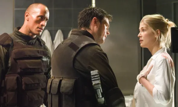 Dwayne "The Rock" Johnson and Rosamund Pike shared the screen in the 2005 movie adaptation of the video game Doom