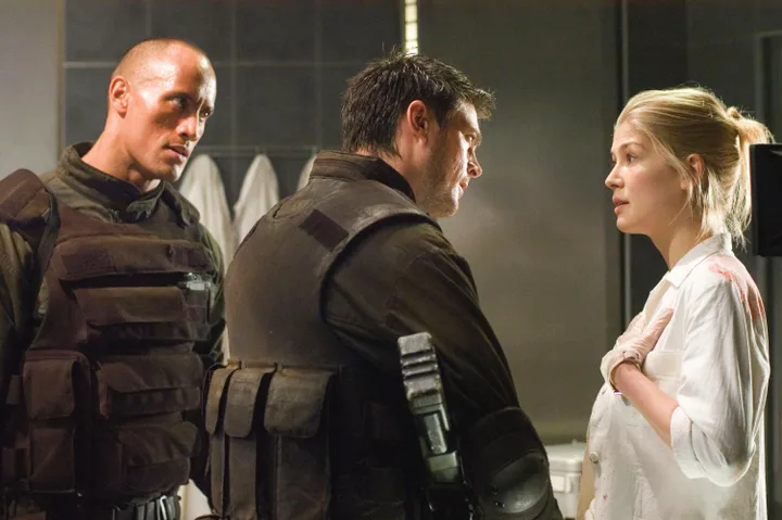 Dwayne "The Rock" Johnson and Rosamund Pike shared the screen in the 2005 movie adaptation of the video game Doom