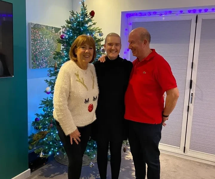 Lizzie with her parents