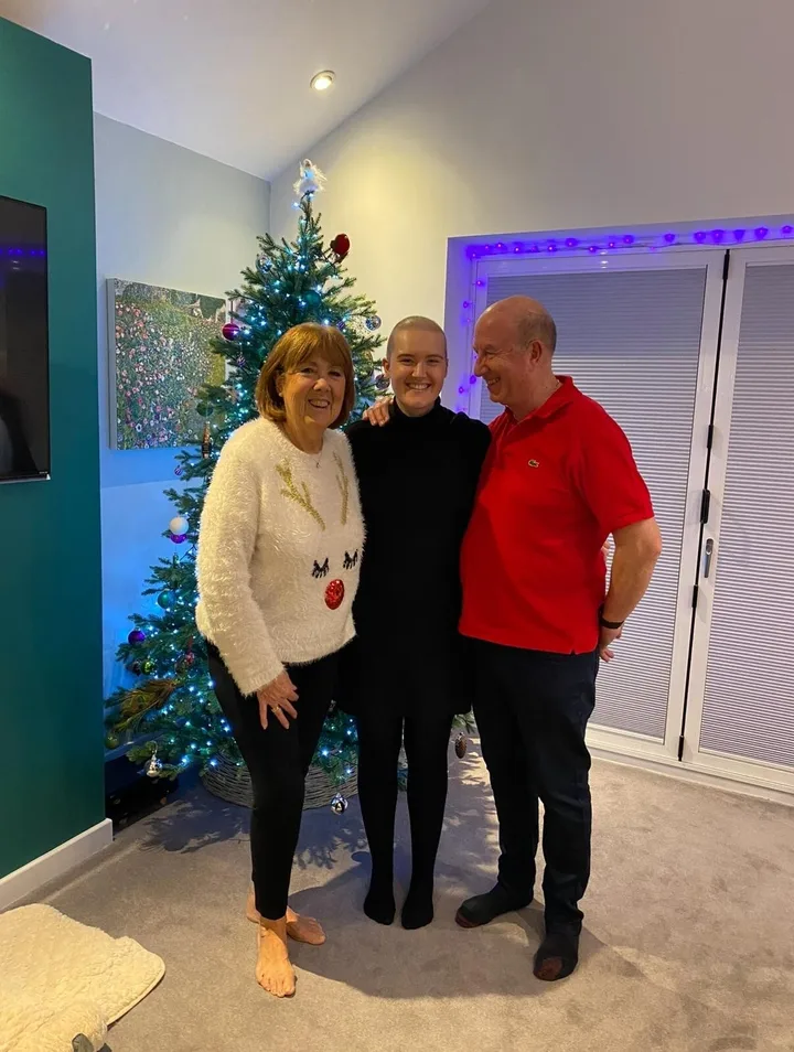 Lizzie with her parents