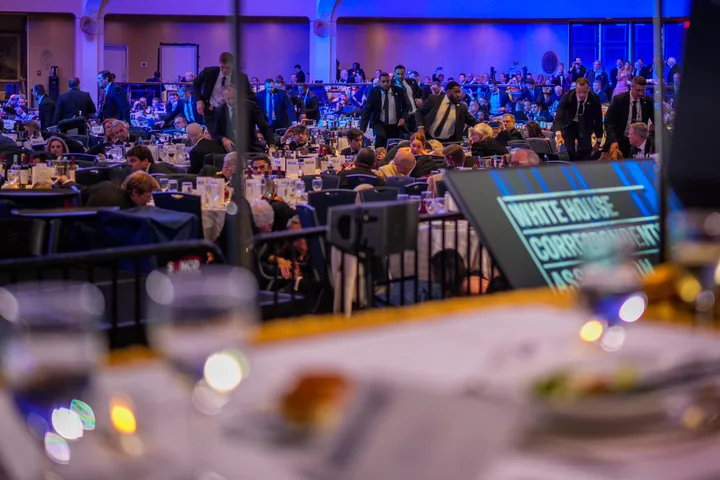 Secret Service agents move across the ballroom Saturday during a shooting incident at the annual White House Correspondents' Association dinner at the Washington Hilton in Washington, D.C.