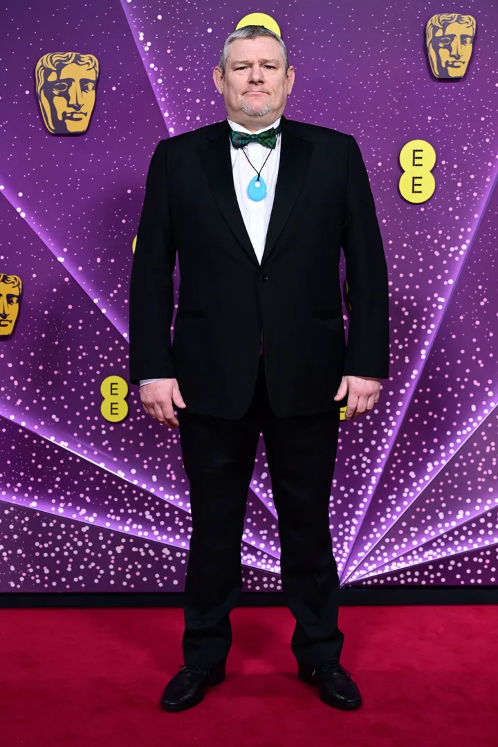 John Davidson arriving at the 2026 Baftas