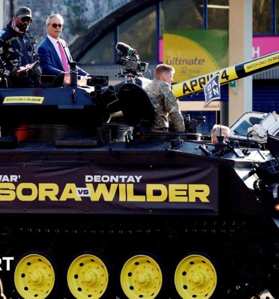 Derek Chisora and Nigel Farage on a tank