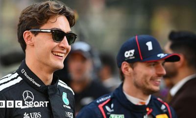 George Russell and Max Verstappen smiling prior to the F1 Grand Prix of Abu Dhabi in December 2025