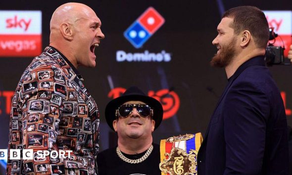 Tyson Fury screams at Arslanbek Makhmudov in jest at a news conference in London