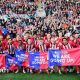 The Lincoln City squad celebrating their promotion infront of their visiting supporters at Reading's Select Car Leasing Stadium.