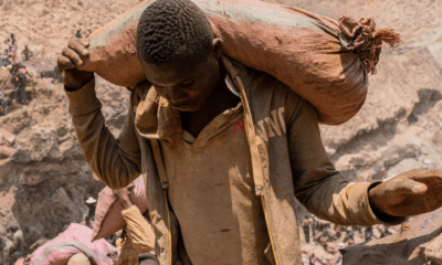 An artisanal miner carries a sack of ore at the Shabara artisanal mine near Kolwezi, DRC, on Oct. 12, 2022.